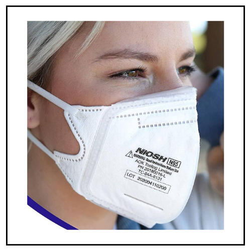 photo of white N95 duckbill respirator opened to full shape