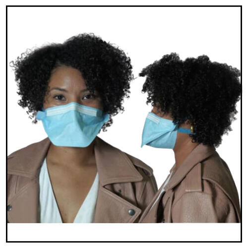 photo of a Black light skinned person wearing a tan jacket and white tshirt. The person is also wearing a blue duckbill respirator with head straps tucked under their black 4C curly hair