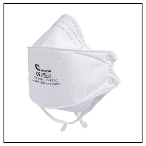 photo of white bifold N95 respirator in front of it's boxed packaging